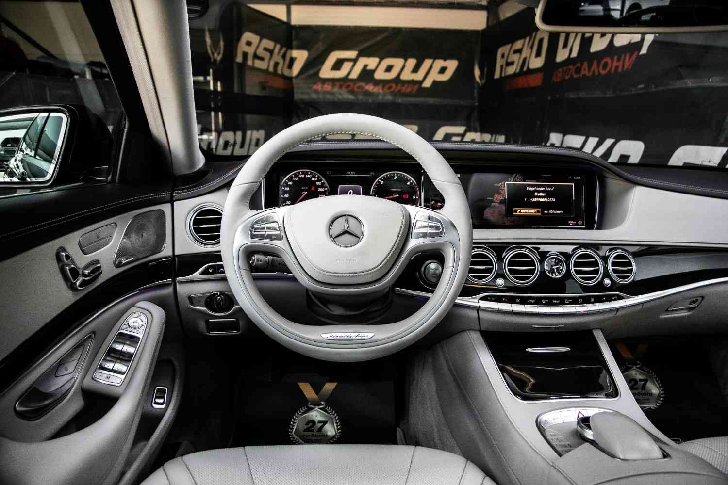 Driver's perspective inside a high-end luxury vehicle showing safety features and comfort